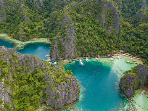 Aerial view to tropical lagoon with azure water and traditional sailing boats near Kayangan Lake  Coron island. Palawan  Philippines.