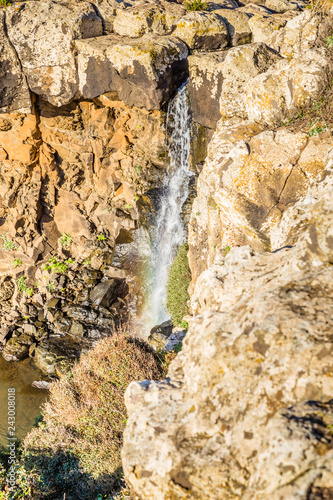 Waterfall near Capo Nieddu near Bosa at the Northern East coast of Sardinia, in Italy