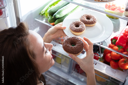 Happy Woman Taking Donut From Plate