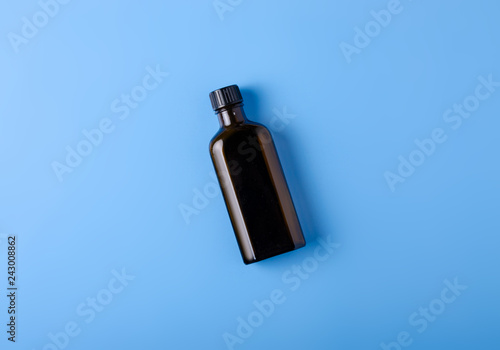 throat cough syrup medicine health on blue background top view