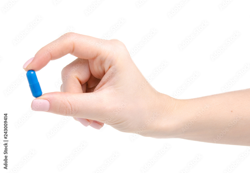 Pill capsule blue in hand medicine health on white background isolation Pill capsule blue in hand medicine health on white background isolation