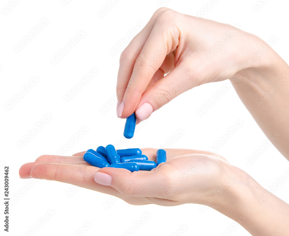 Pills capsules blue in hand medicine health on white background isolation Pills capsules blue in hand medicine health on white background isolation
