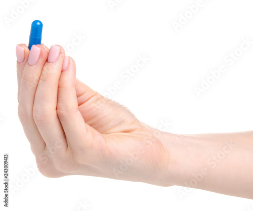 Pill capsule blue in hand medicine health on white background isolation