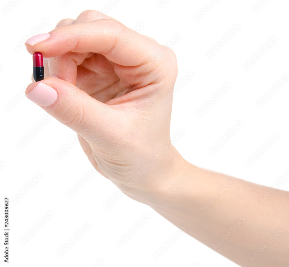 Pill capsule black red in hand medicine health on white background isolation Pill capsule black red in hand medicine health on white background isolation
