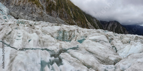 Franz Josef Glacier crampons hike through the blue glacier ice - New Zealand, South Island, NZ