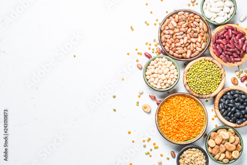 Legumes, lentils, chikpea and beans assortment on white. photo
