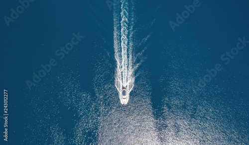 Yacht on the sea from top view. Aerail view at the boats. Sea background from top view. Summer seascape from air. Travel concept and idea