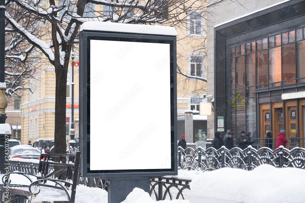 Vertical mock-up of city poster winter city with thick edges, blank white billboard in urban settings, empty street information placeholder on sidewalk with copy space for logo