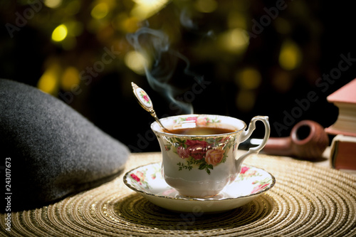 hot tea cup gold bokeh hat smoking pipe 