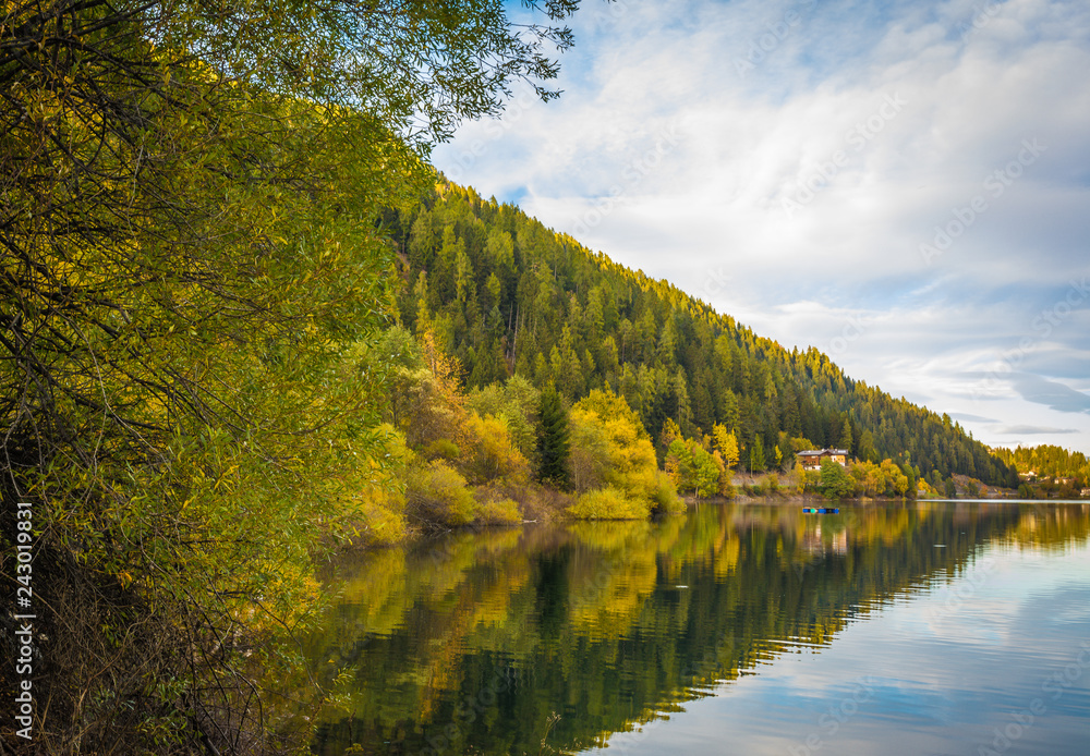 autumn landscape in Ultental ( Ultimo Valley) with a trees in autumn colors.the Lake Zoccolo ,Dolomites, South Tyrol, province of Bolzano, Italy, Europe. autumn landscape in Ultental ( Ultimo Valley) with a trees in autumn colors.the Lake Zoccolo ,Dolomites, South Tyrol, province of Bolzano, Italy, Europe.