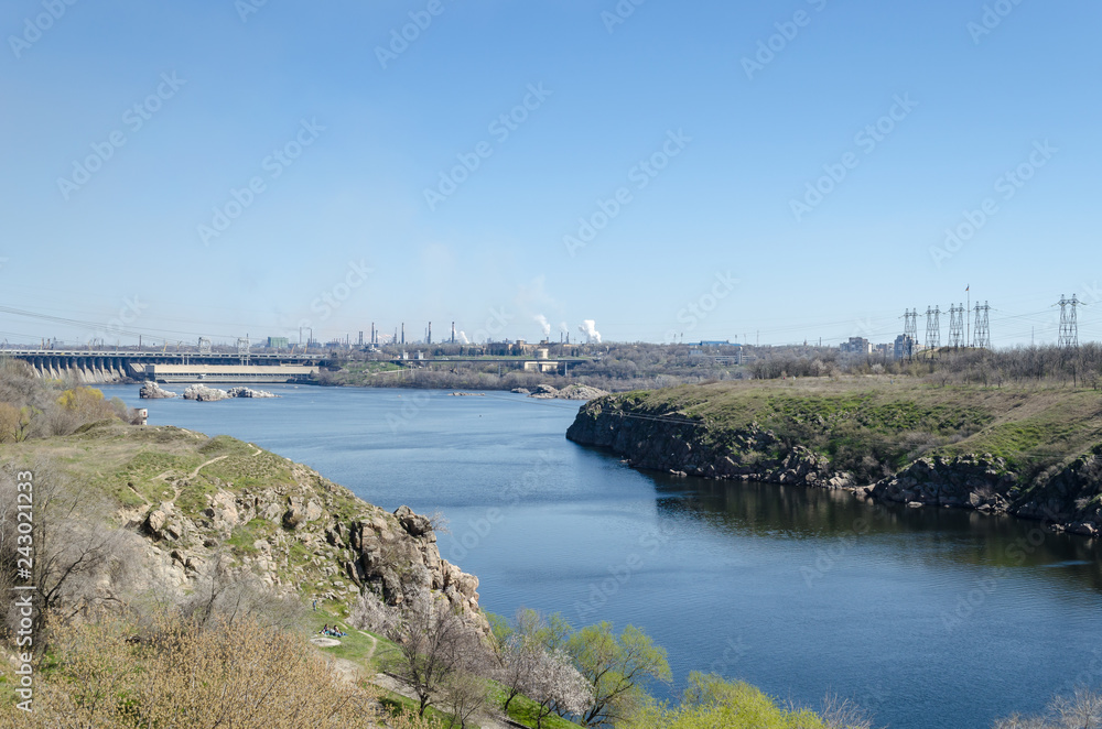 View from the island of Khortytsya (Ukraine) on the dam (Dneproges) and rocks.