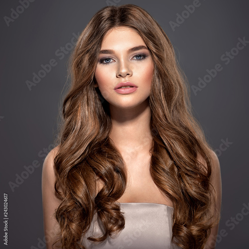 Bild auf Leinwand Closeup face of a beautiful girl with makeup in style smoky eyes