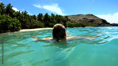 Tahuata Marquesas young female on deserted ocean beach photo