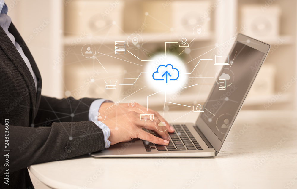 Business woman in homey environment using laptop with online storage and cloud technology concept
Business woman in homey environment using laptop with online storage and cloud technology concept