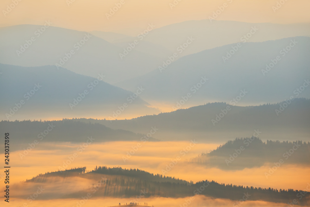 beautiful mountain landscape, mountain silhouette in the blue mist at the early morning