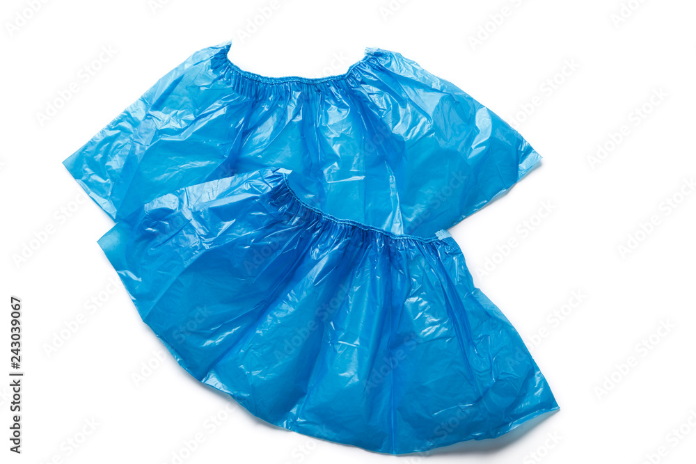 Obraz premium Two medical blue shoe covers overshoes isolated on white background. Catalog top view