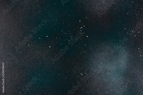 Dark background with green spots. Top view