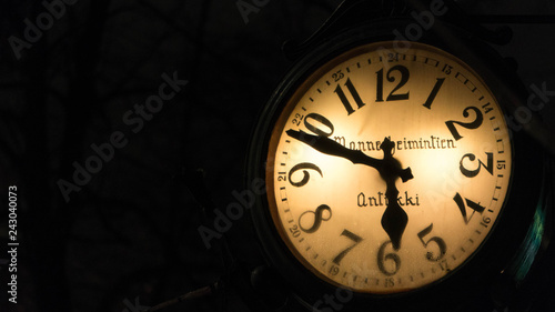 old clock on black background
