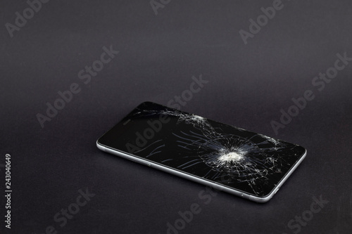 Wallpaper Mural Phone screen crash or durability, endurance test concept on the black background. It could be used in technological area, news, etc. Torontodigital.ca