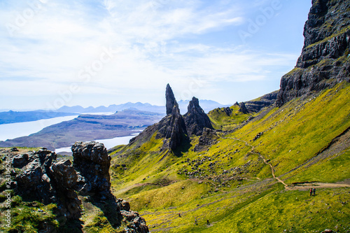 Travel Europe, Scotland, Highlands, Isle of Skye (Tourist popular destination). Scenic mountain landscape view of The Old Man Of Storr attraction, sharp rocks and lakes on background in summer time.