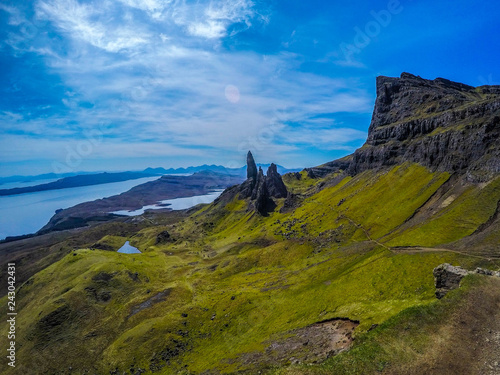 Travel Europe, Scotland, Highlands, Isle of Skye (Tourist popular destination). Scenic mountain landscape view of The Old Man Of Storr attraction, sharp rocks and lakes on background in summer time.
