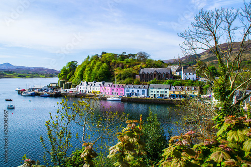 Scenic landscape view of colorful buildings/houses in harbour of Portree town on Isle Of Skye in Scotland, United Kingdom. Popular tourist attraction/destination in Europe. Summer active holiday. photo