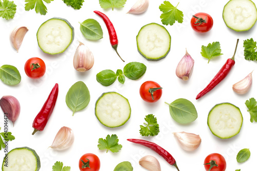 Vegetable and spices isolated on white background, top view. Wallpaper abstract composition of vegetables.