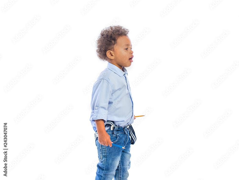 Boy With Curly Hair In Jeans And A Light Colored Shirt Is Standing In A Half Turn Holding A Pencils In Both Hands And Looking To The Side Stock Photo Adobe Stock Boy With Curly Hair In Jeans And A Light Colored Shirt Is Standing In A Half Turn Holding A Pencils In Both Hands And Looking To The Side Stock Photo Adobe Stock