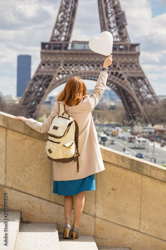 girl on the background of the Eiffel Tower