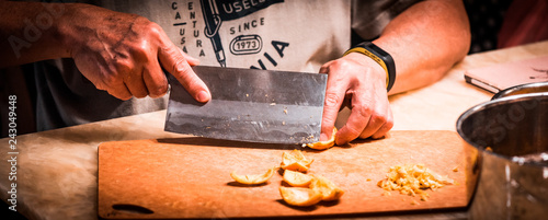 Man slicing orange peel