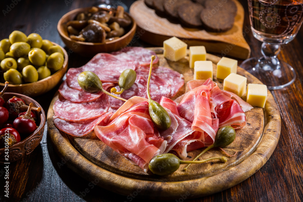 Serrano ham platter with variation of appetizers