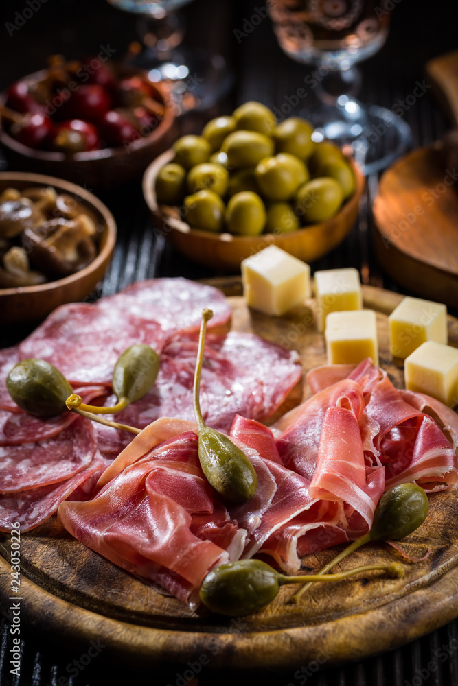 Serrano ham platter with variation of appetizers Serrano ham platter with variation of appetizers