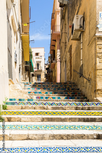 Canvastavla Colorful ceramic tiles decorating a stair in Sciacca old town, Sicily, Italy
