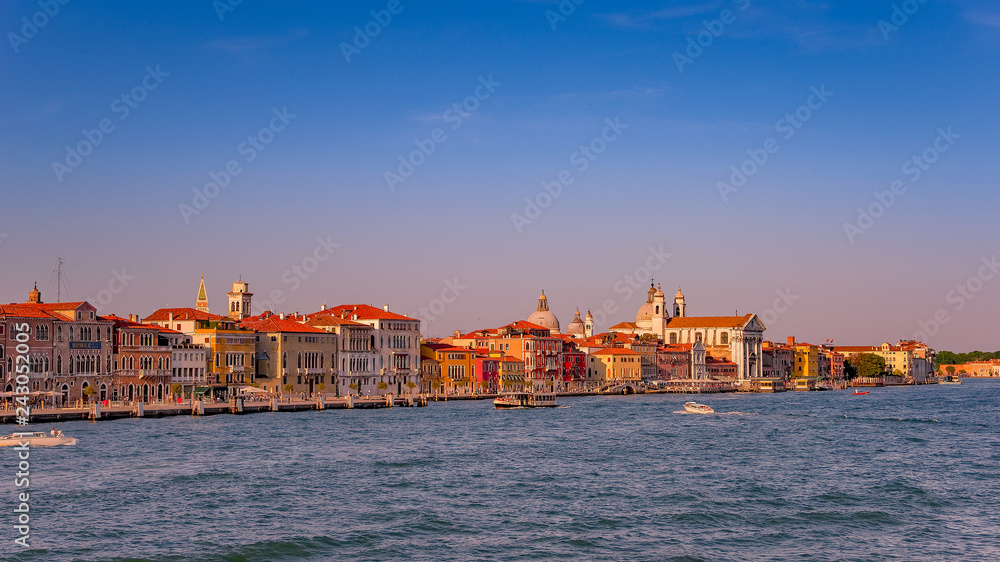 Warm reddish sunset over amazing Venetian Grand Channel, Venice, Italy, summer time