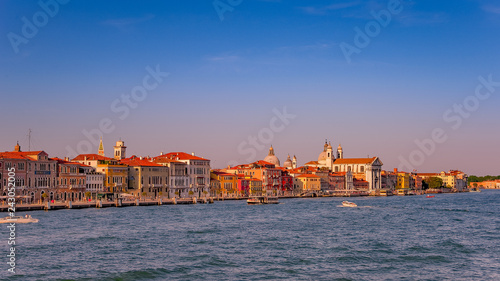Warm reddish sunset over amazing Venetian Grand Channel, Venice, Italy, summer time