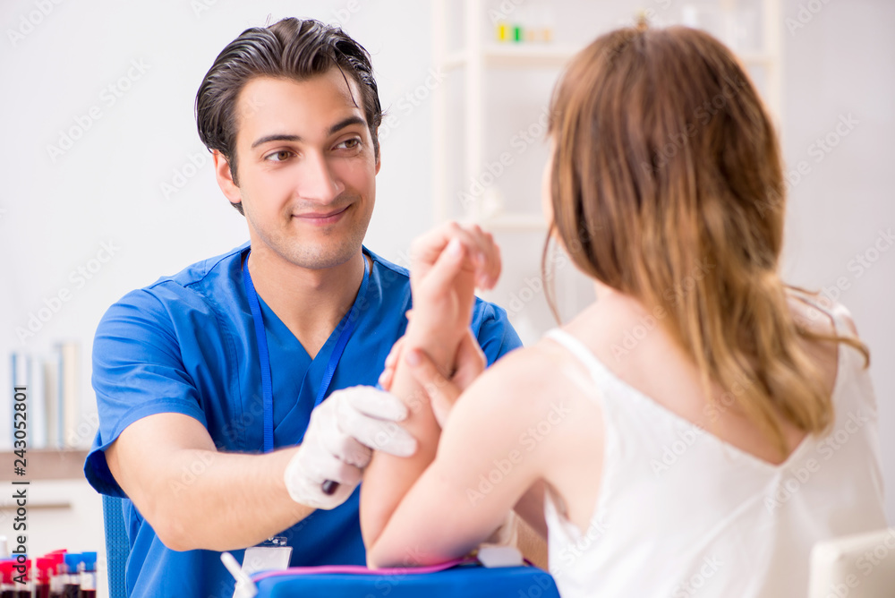 Young patient during blood test sampling procedure Young patient during blood test sampling procedure