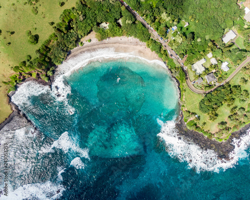 Stunning aerial view of Hamoa Beach,  a remote beach located near the little town of Hana on the east side of the island of Maui, Hawaii. Hamoa Beach is consistently named one of “Maui’s Best Beaches” © Juergen Wallstabe