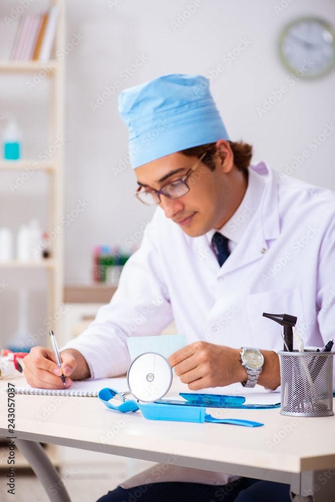 Young male doctor otolaryngologist working at the hospital Young male doctor otolaryngologist working at the hospital