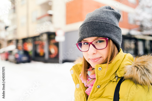 portrait of young woman in winter city