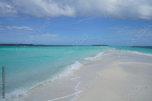 Amazing turquoise water view along a beach in the Maldives