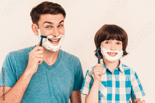Young Father Teaches Little Son to Shave at Home.