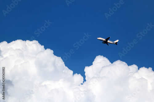 Airplane in the sky with white clouds and blue sky at samui island © THANAGON