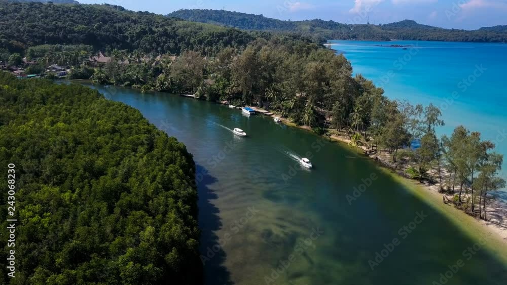 Aerial view of speedboat in turquoise blue sea water of Koh (island) Kood,Trat, Thailand (video from drone) Aerial view of speedboat in turquoise blue sea water of Koh (island) Kood,Trat, Thailand (video from drone)