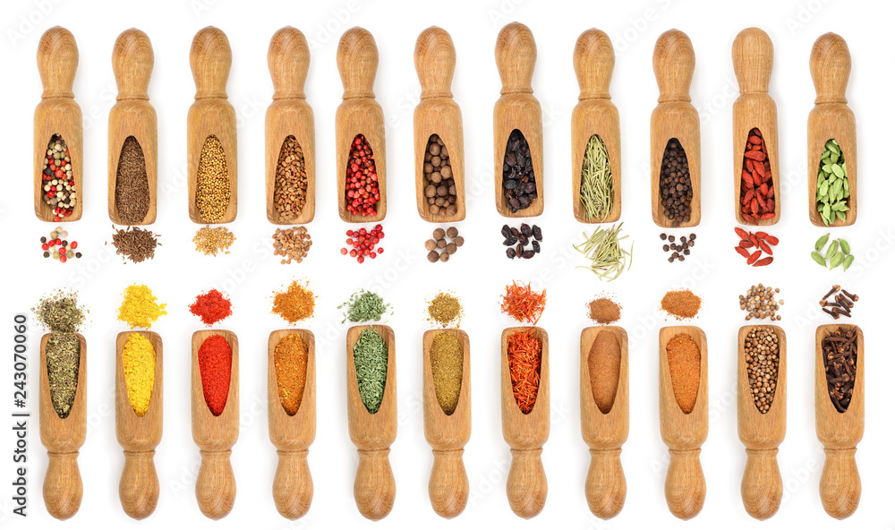 mix of spices in wooden scoop isolated on a white background. Top view. Flat lay. Set or collection mix of spices in wooden scoop isolated on a white background. Top view. Flat lay. Set or collection