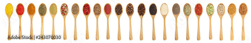 mix of spices in wooden spoon isolated on a white background. Top view. Flat lay. Set or collection