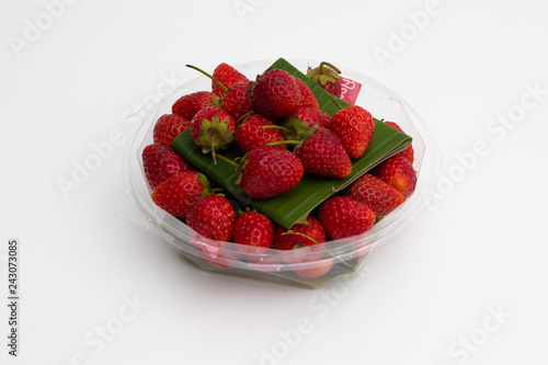 Fresh Red Strawberries on white plate on white background