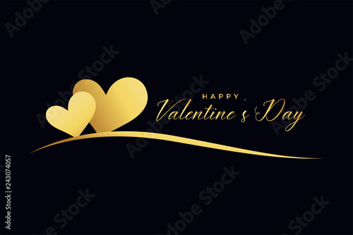 two golden hearts on black background for valentines day