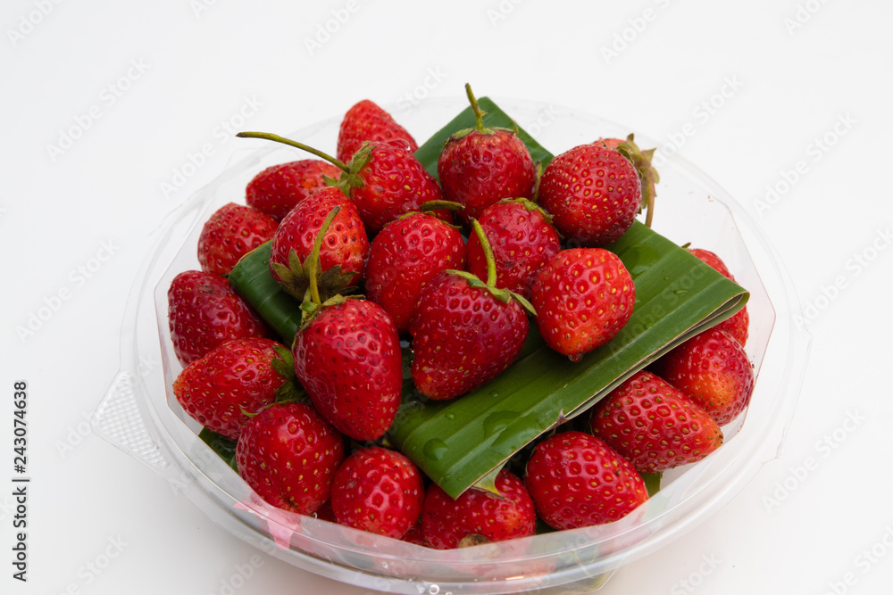 Fresh Red Strawberries on white plate on white background Fresh Red Strawberries on white plate on white background