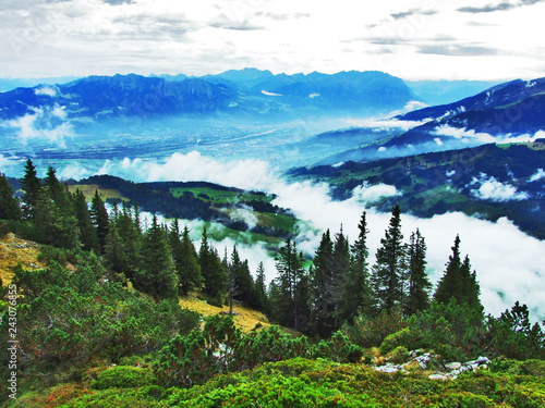 Fall colors in forests of Alpstein mountain range and Thur River valley - Canton St. Gallen, Switzerland photo