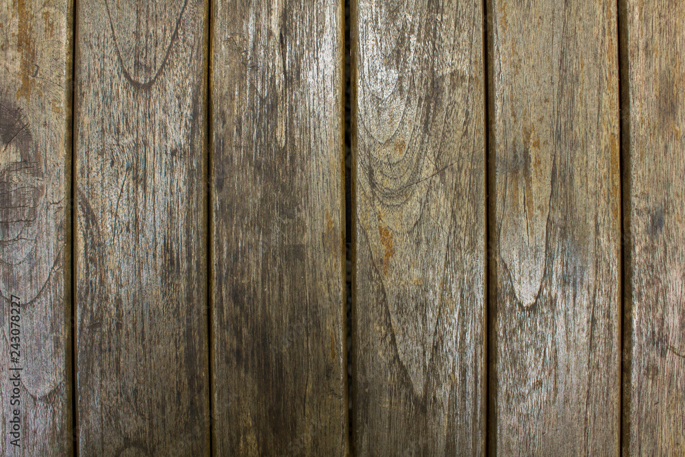 old gray wooden fence boards. vertical lines. natural surface texture old gray wooden fence boards. vertical lines. natural surface texture